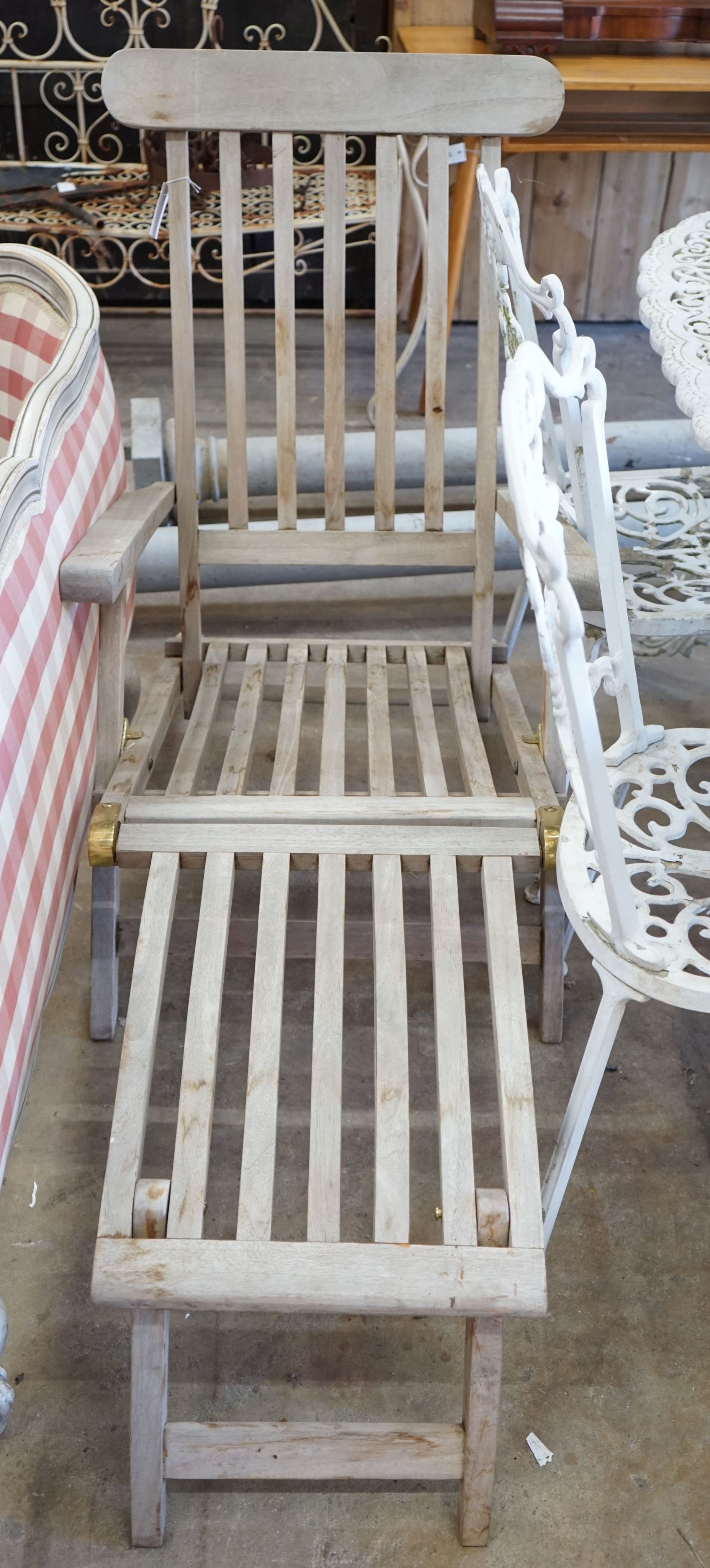 A brass mounted weathered teak garden steamer chair